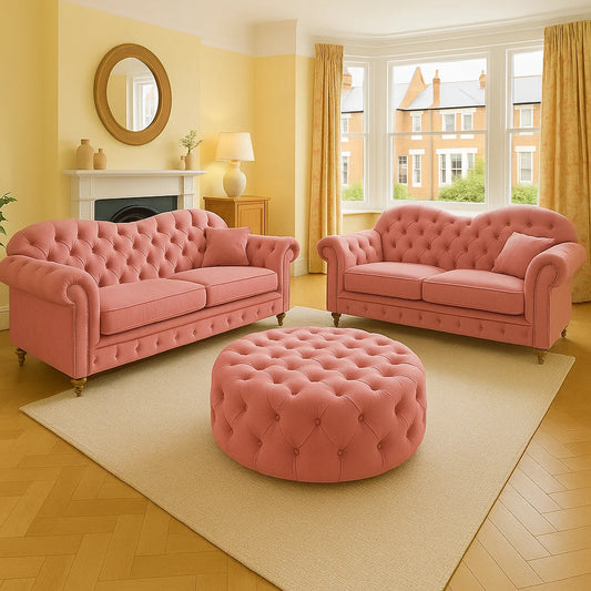 Pink sofa set with ottoman in a living room with yellow walls and large windows.